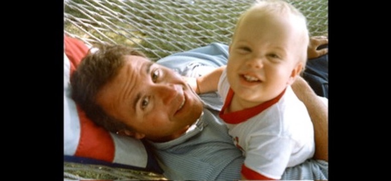 Leland as a baby with his father Mark in a hammock - the foundation of unconditional love