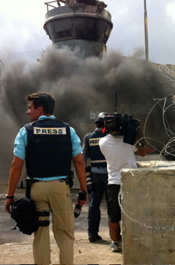 Leland Vittert as war correspondent covering conflicts in the Middle East